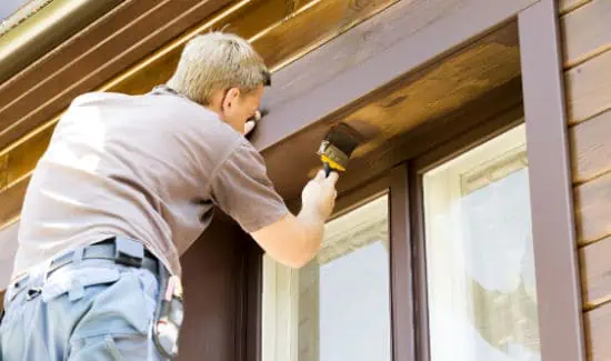 Refinishing exterior windows and trim.